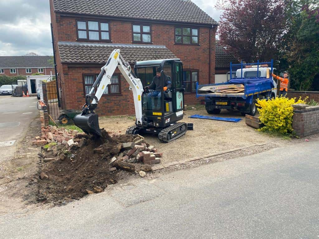 This is a photo of an operative of Gravesend Driveways Digging out for a new tarmac driveway